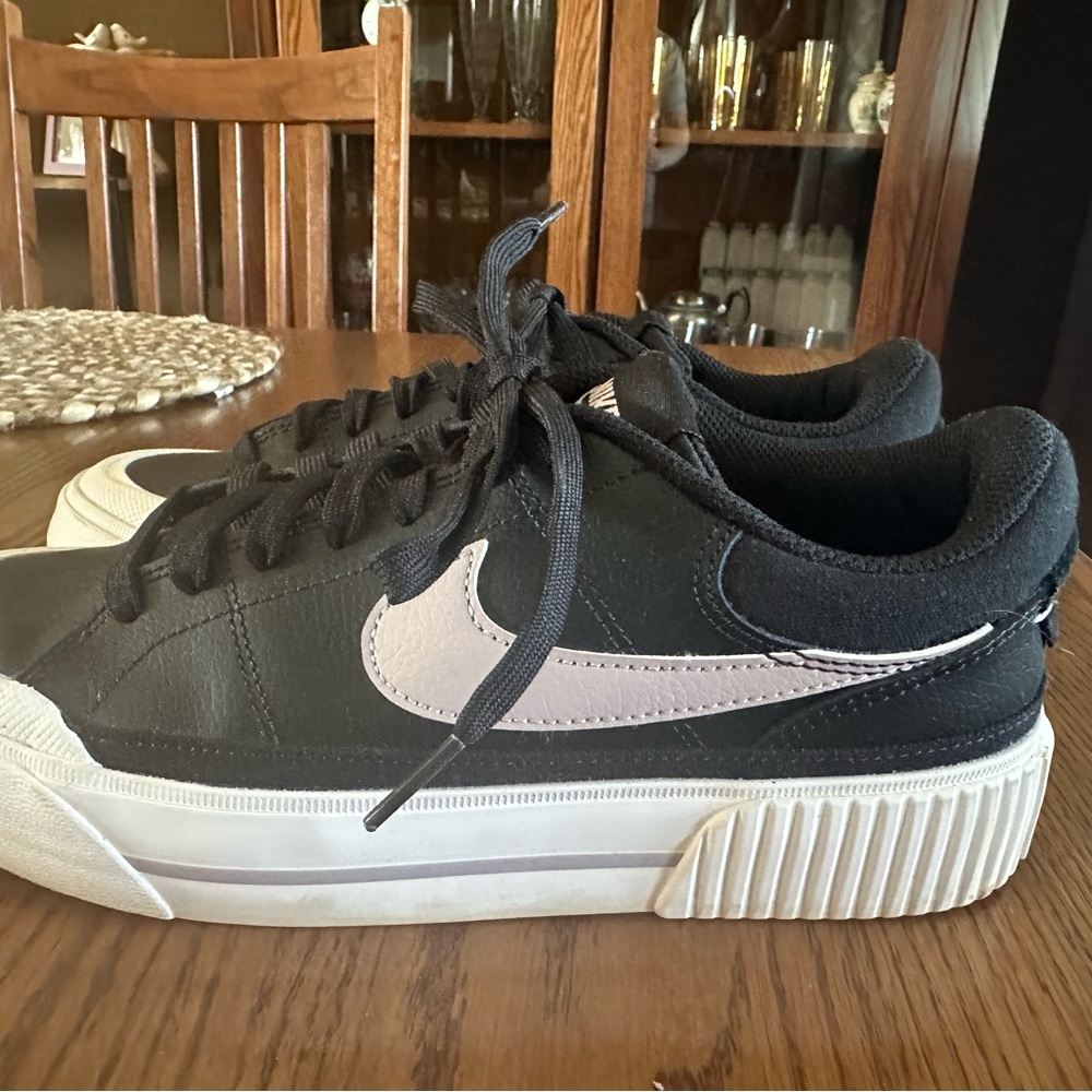 Black and White Sneakers with Purple Nike Swoosh Logo